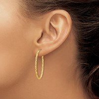 14K 2mm Yellow Gold Diamond-cut Oval Hoop Earrings view 3