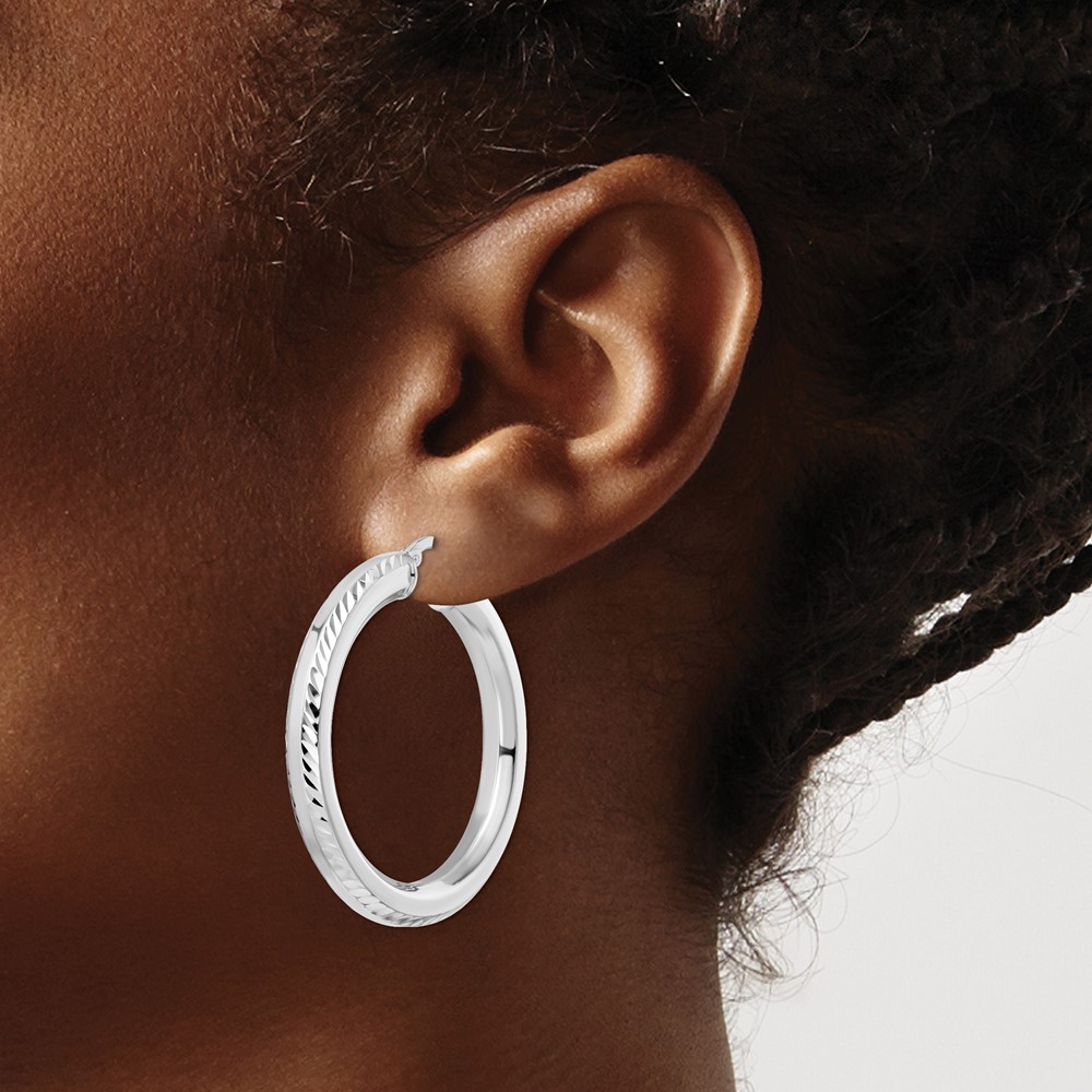 Sterling Silver Rhodium-plated 5x38mm D/C Octagon Tube Hoop Earrings (QE15872)