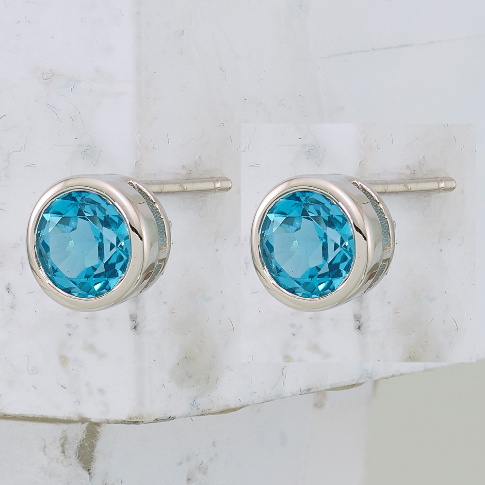 Sterling Silver Rhodium-plated Blue Topaz Circle Stud Earrings (QE9411BT)