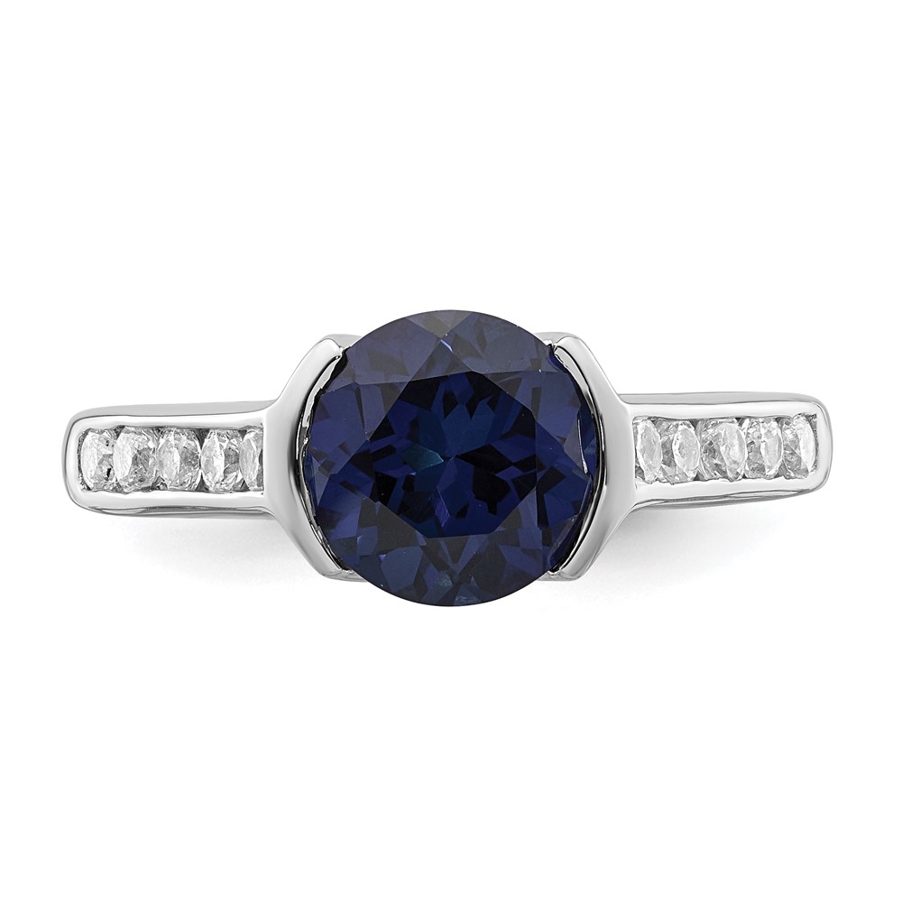Sterling Silver Rhodium-plated Synthetic Blue Sapphire and CZ Bezel Ring (QR6349-8)